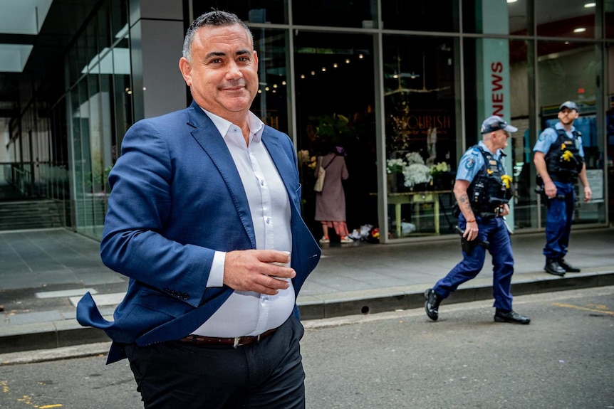 a man walking down the street and smiling