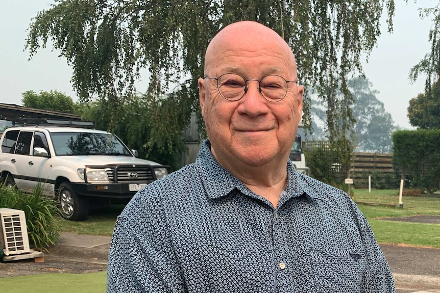 Victor Boscoe standing outdoors in his East Gippsland caravan park.