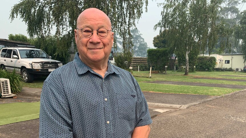 Victor Boscoe standing outdoors in his East Gippsland caravan park.