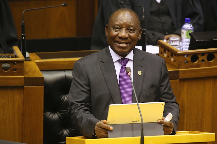 President Cyril Ramaphosa smiles as he delivers his optimistic speech about the future