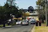 Police at crime scene where woman was allegedly attacked by former partner with machete at Wacol