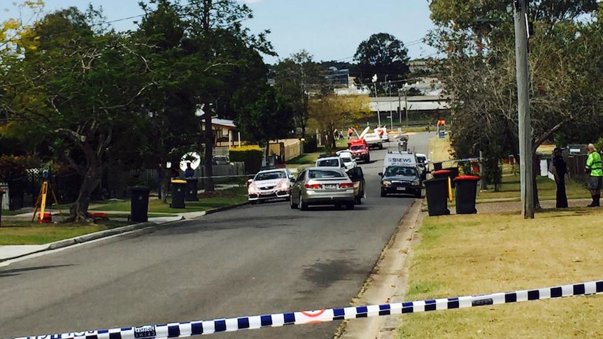 Police at crime scene where woman was allegedly attacked by former partner with machete at Wacol