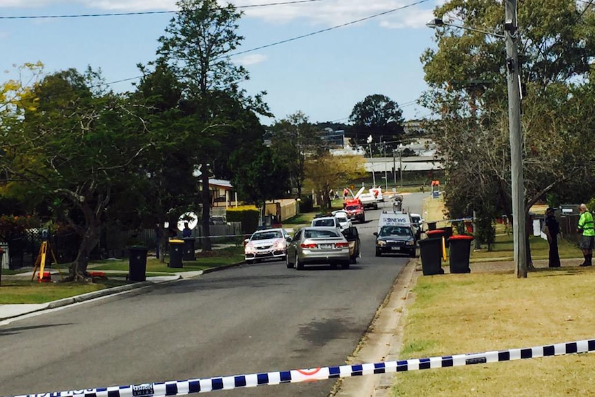 Police at crime scene where woman was allegedly attacked by former partner with machete at Wacol