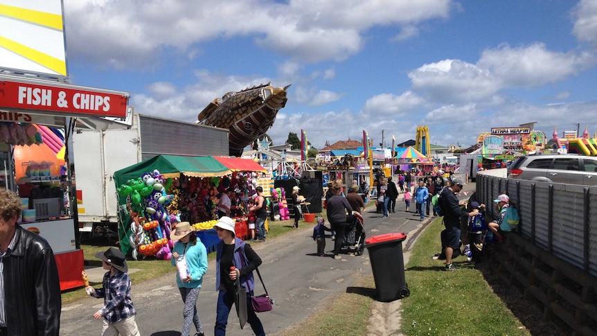 People walking through sideshow alley at this year's Devonport Show.