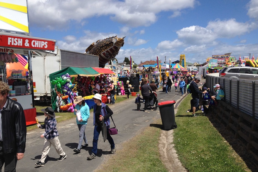 People walking through sideshow alley at this year's Devonport Show.