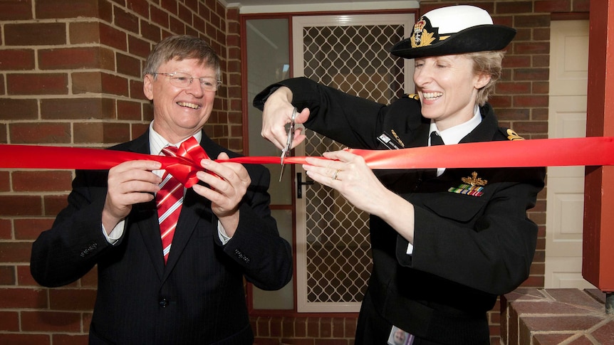 Peter Howman and Captain Katherine Richards, RAN, open the first upgraded house of HMAS Cerberus.