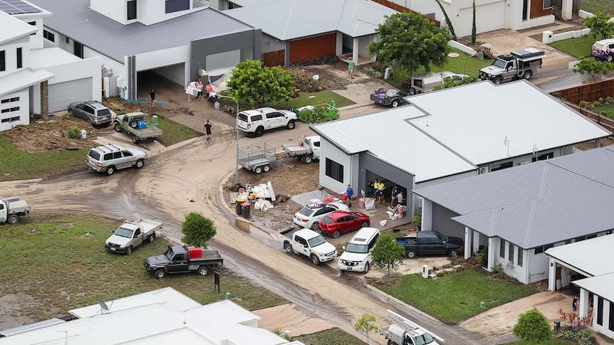 Aerial photo of residents cleaning up their homes as floodwaters ease in parts of Townsville.
