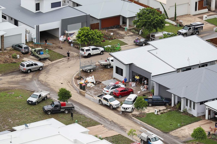 Aerial photo of residents cleaning up their homes as floodwaters ease in parts of Townsville.