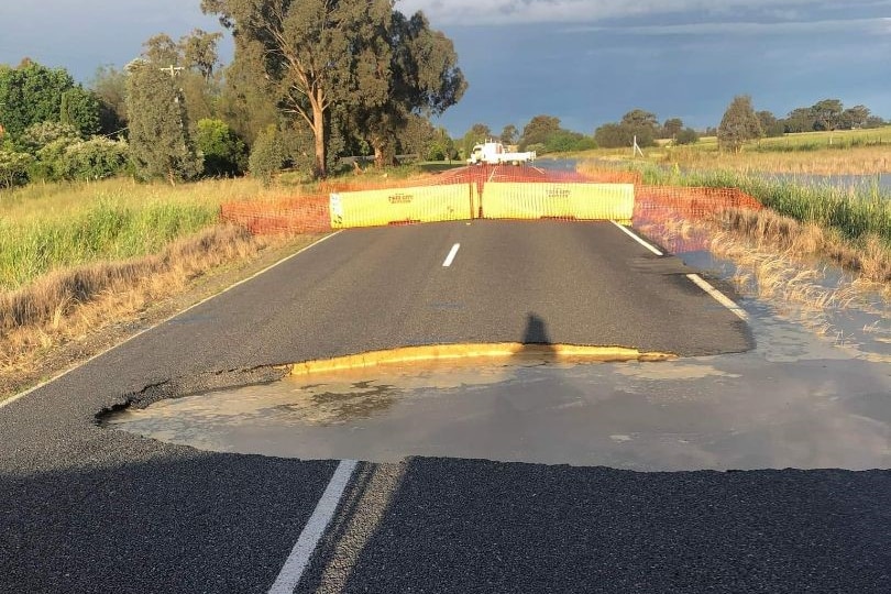 A road with a large pothole