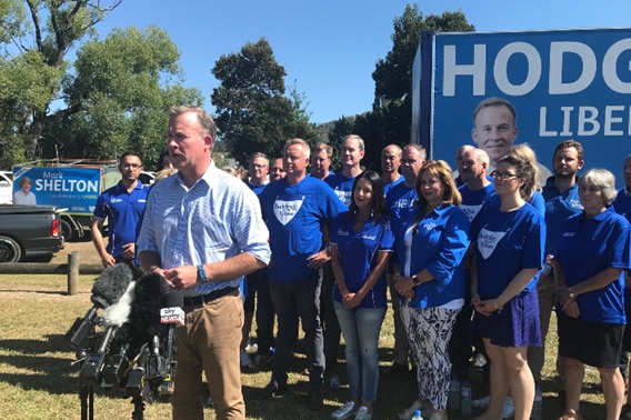 Tasmanian Premier Will Hodgman stands with his team of candidates