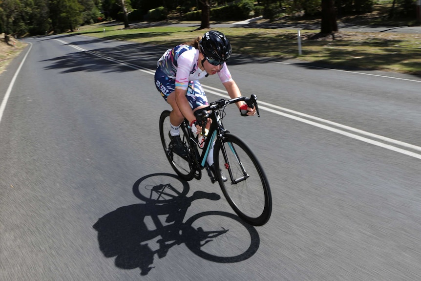 Sarah Gigante speeds down the road on a bicycle at Mount Buninyong.