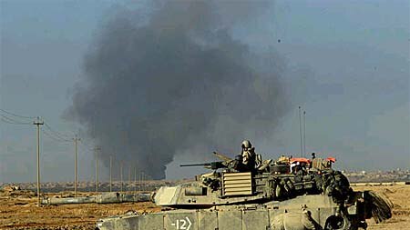 Smoke rises over Najaf