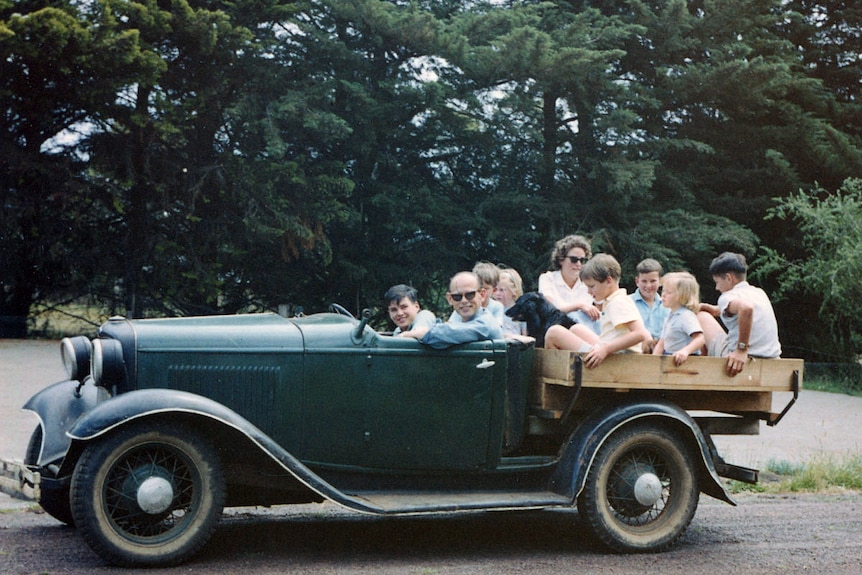 Mark Colvin, his father and cousins in their old bomb on a farm in Victoria, Christmas 1959