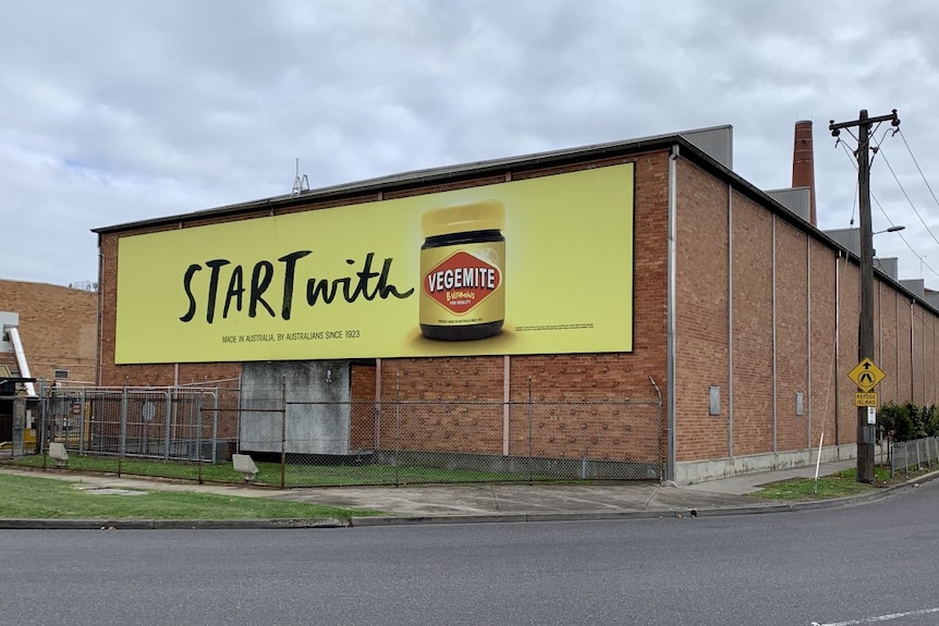 The Vegemite factory building, made of red bricks with a sign advertising Vegemite on the front.