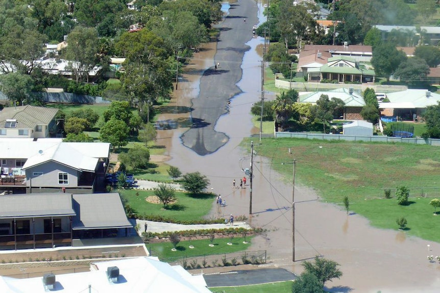 North Moree residents on Kamilaroi Drive inspecting floodwater
