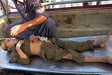 An injured Pakistani arrives at hospital following a suicide bombing at a mosque in the Mohmand tribal district.
