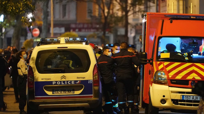 Police officers block a street in Lyon after a Greek Orthodox priest was shot.