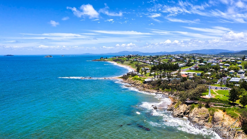 An aerial shot of a stunning coastline with turquoise waters.