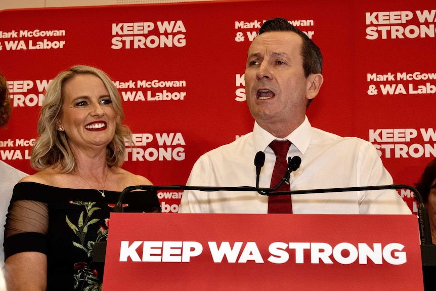 Mark McGowan at a podium in front of Labor background.