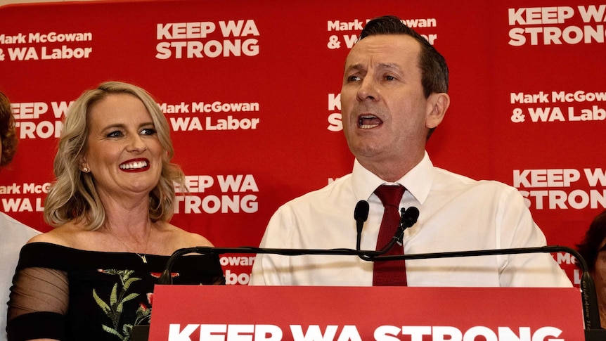 Mark McGowan at a podium in front of Labor background.