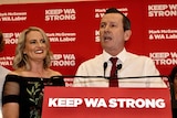 Mark McGowan at a podium in front of Labor background.