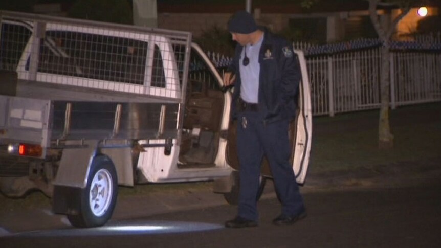 Qld police at scene where a man and a woman in a parked car were shot at in Hickory Street at Marsden