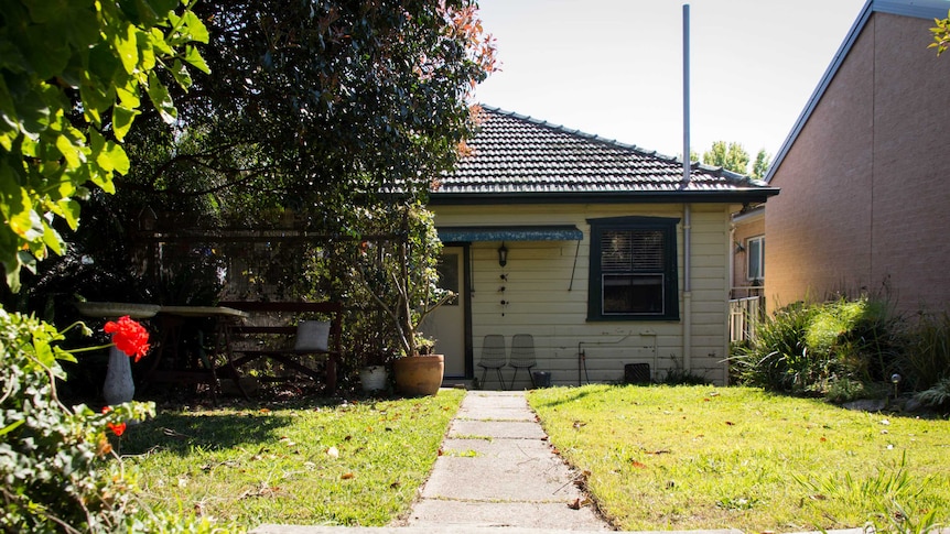 A suburban house in Newcastle with front lawn.