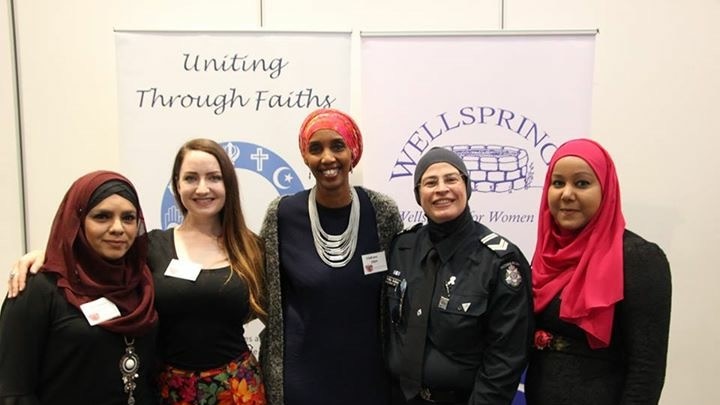 Five women from different religions and faiths standing together.