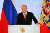 Russian President Vladimir Putin delivers a speech during his annual state of the nation.