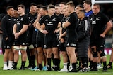 All Blacks player stand on the field after losing to the Springboks at Twickenham.