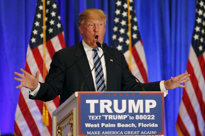 Donald Trump speaking at a podium in Florida.