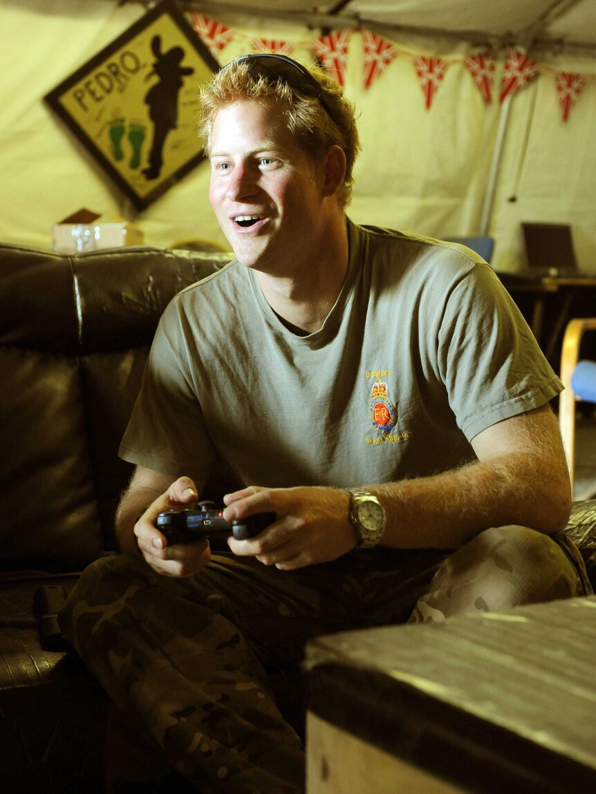 Prince Harry plays computer games at Camp Bastion in Afghanistan's Helmand Province.