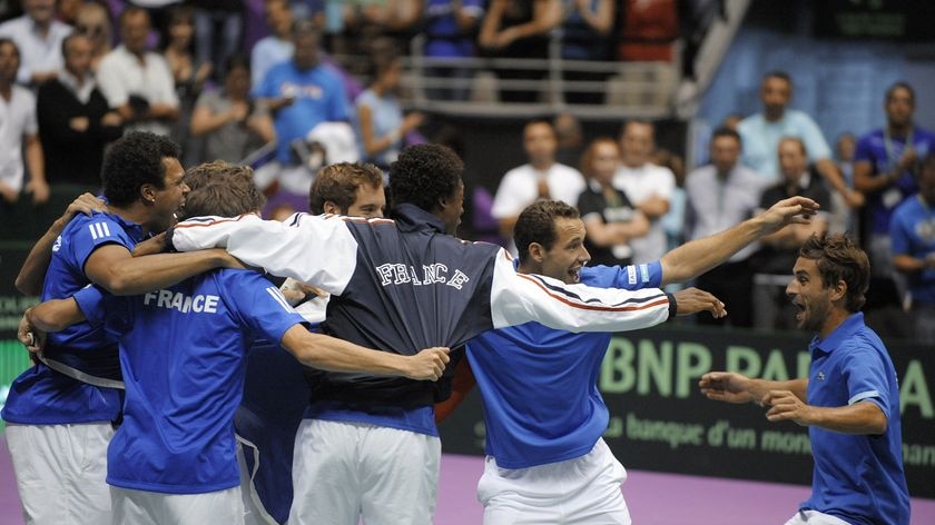 France celebrate its return to the Davis Cup final after victory in the doubles.