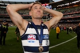 Joel Selwood wearing his AFL premiership medallion on the MCG after the grand final.