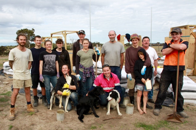 Kendenup earth bag volunteers stand outside the Ryan-Taylors home