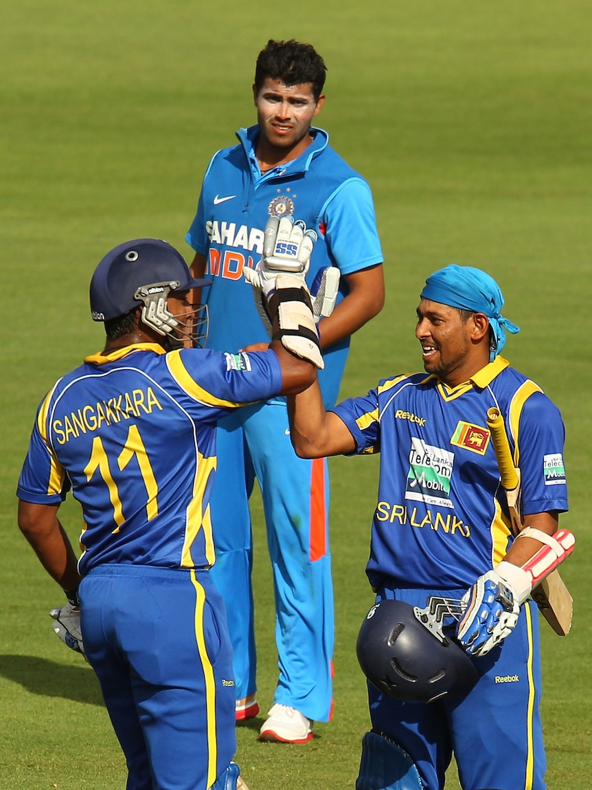 Demolition man ... Sri Lanka's Kumar Sangakkara congratulates Tillakaratne Dilshan (R).