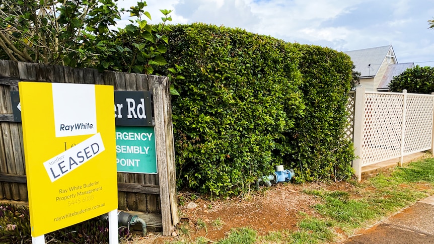 House on the Sunshine Coast with yellow Leased sign out front