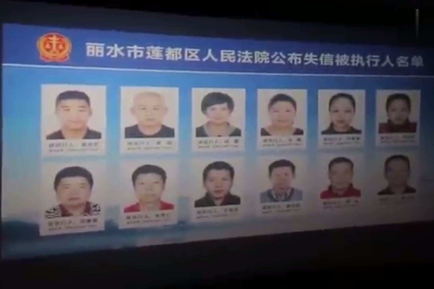 Portraits of debtors are shown on the cinema screen ahead of the premiere of Avengers Endgame in Zhejiang province, China.