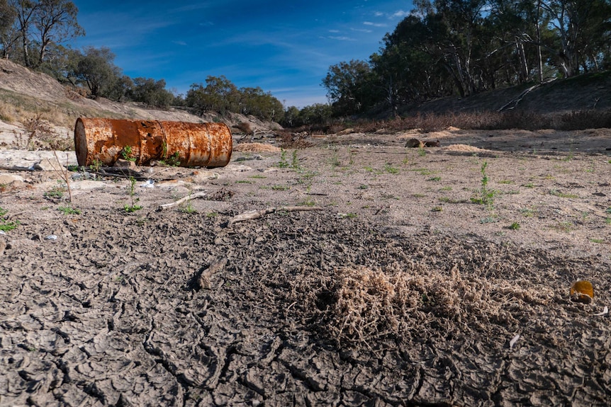 A dry, cracked river bed on the Darling River downstream of the Bourke weir.