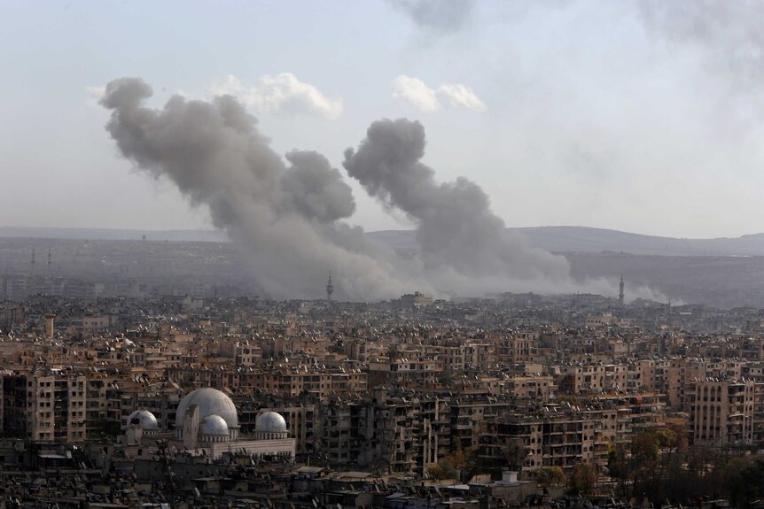 A general view shows rising smoke after strikes on Aleppo city, Syria