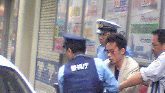 Accused Tokyo knifeman taken away by police