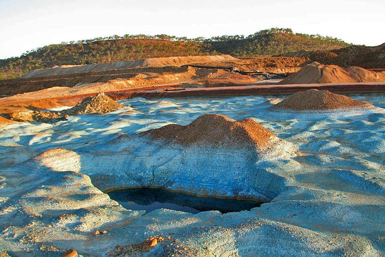 soil turned white by leaching at an old mine.