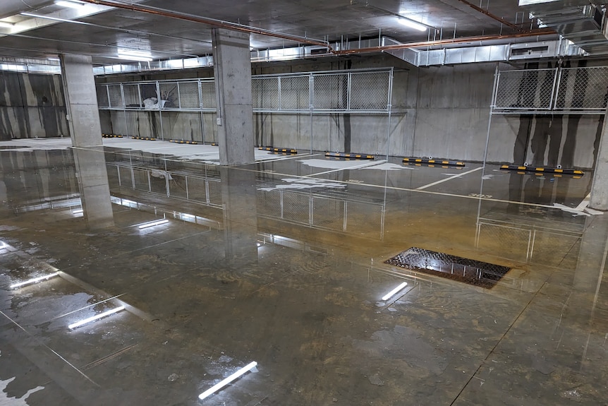 Water pooled in the basement of an underground carpark.