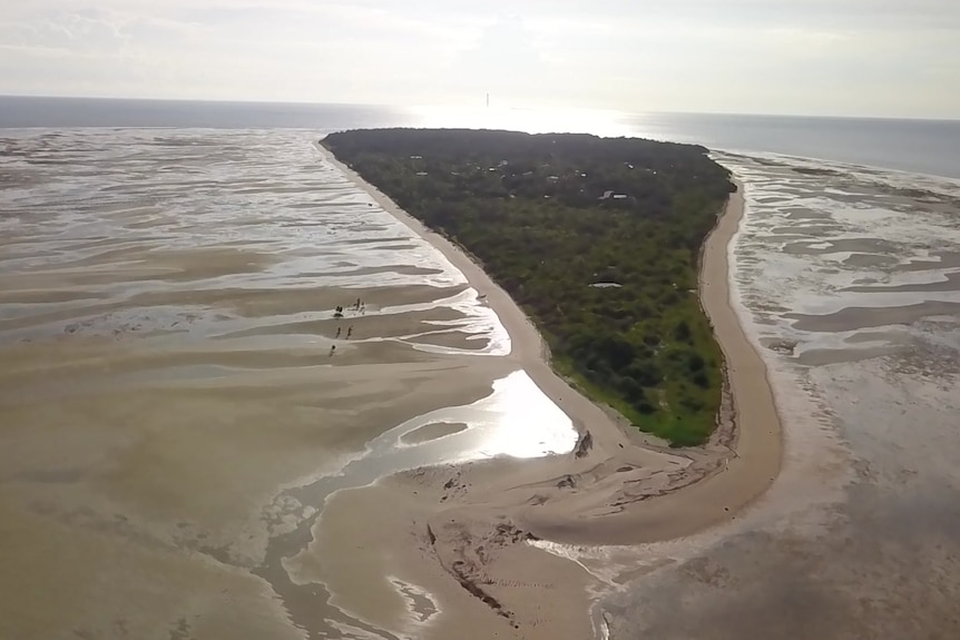 Wide shot of an island. 