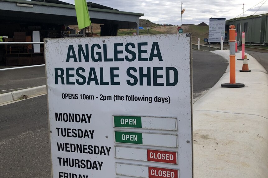 A sign advertising opening hours at Anglesea Resale Centre.