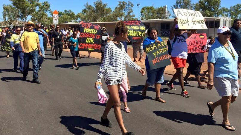 Protesters march in the WA town of Roebourne against the closure of Aboriginal communities