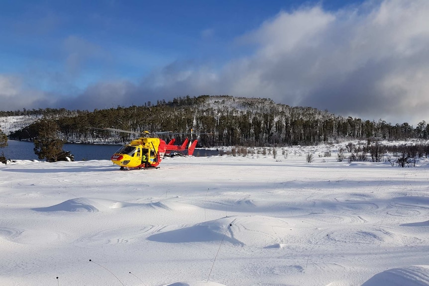 Rescue helicopter lands near a lake in the Walls of Jerusalem