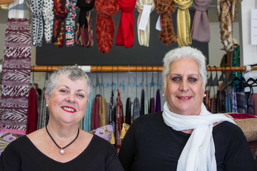Two women in a scarf shop