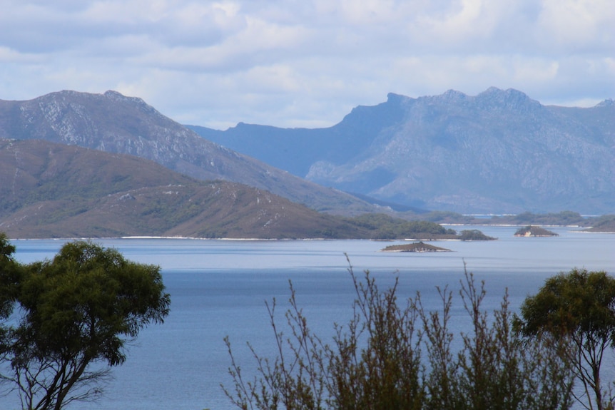 A lake with mountains in the background.