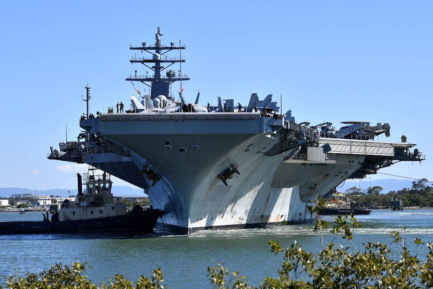 The USS Ronald Reagan arrives at the Port of Brisbane on July 23, 2017
